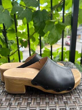 Dansko Black Leather Slide Mules with Tan Footbed